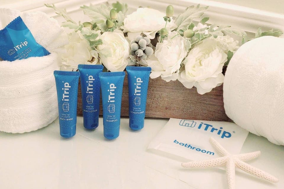 A hospitality-sized amenity pack is placed in each bathroom and in the kitchen; bed linens, bath and pool towels are also provided.