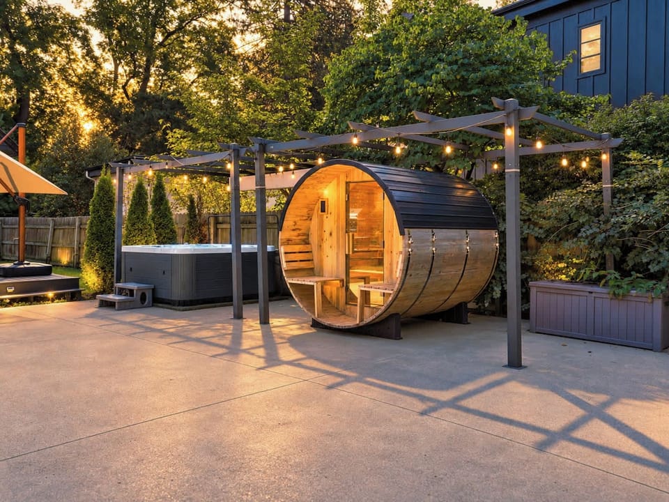Hot tub and barrel sauna create a private backyard retreat