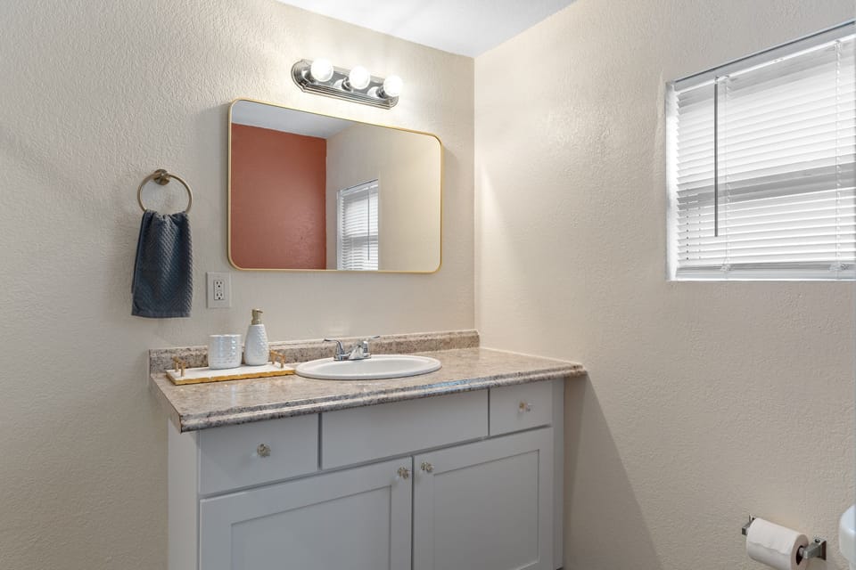 Step into your bright, freshly styled bathroom with a spacious vanity and thoughtful details that make getting ready a pleasure.
