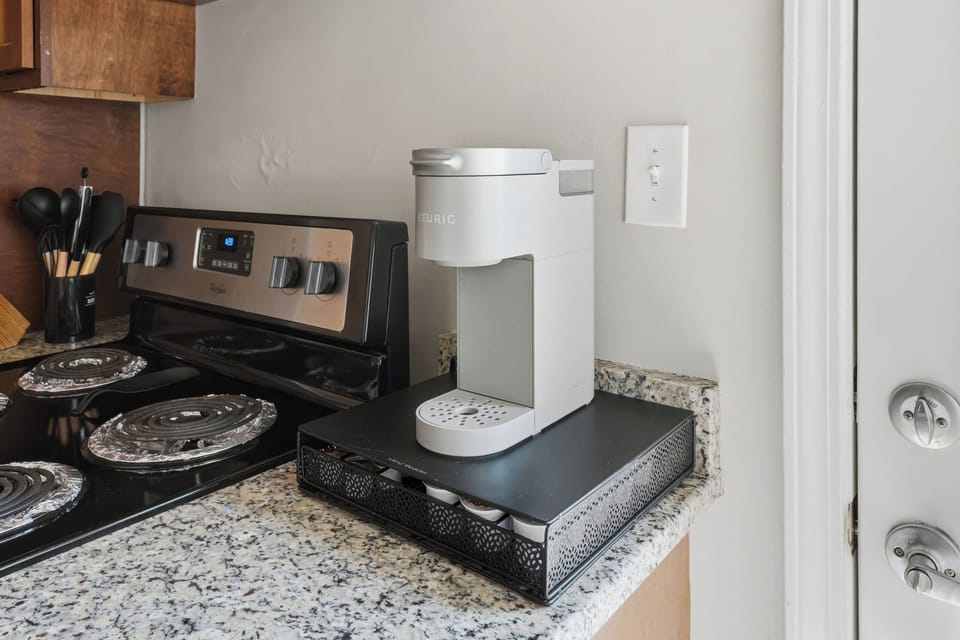 Kitchen: This inviting kitchen offers a functional layout, ample prep space, and convenient essentials for everything from morning coffee to relaxed dinners at home.