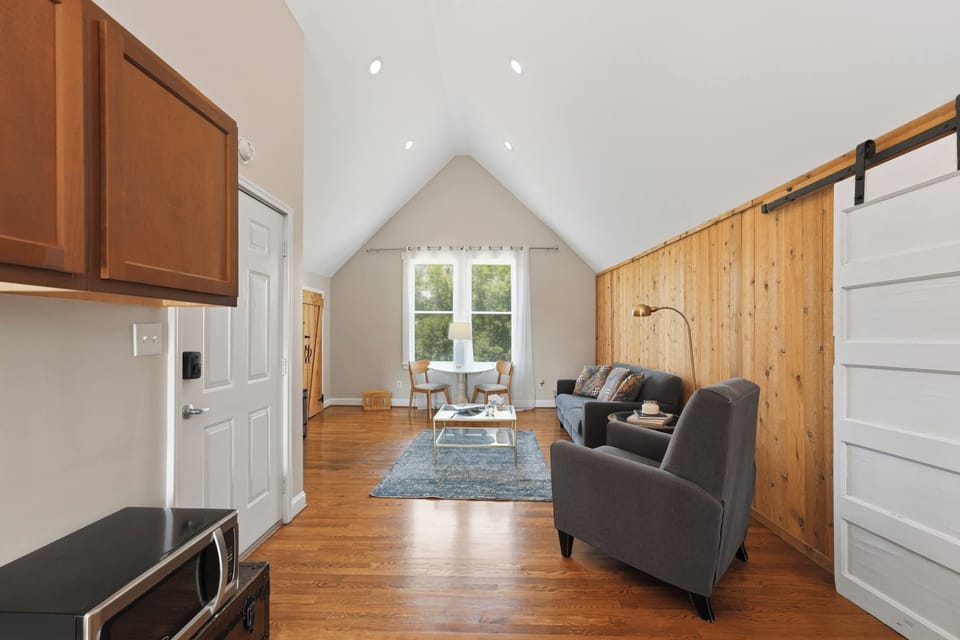 Living Room: Relax in a cozy living room with comfortable seating, warm natural light, and a welcoming layout perfect for unwinding, chatting, or enjoying a quiet night in.