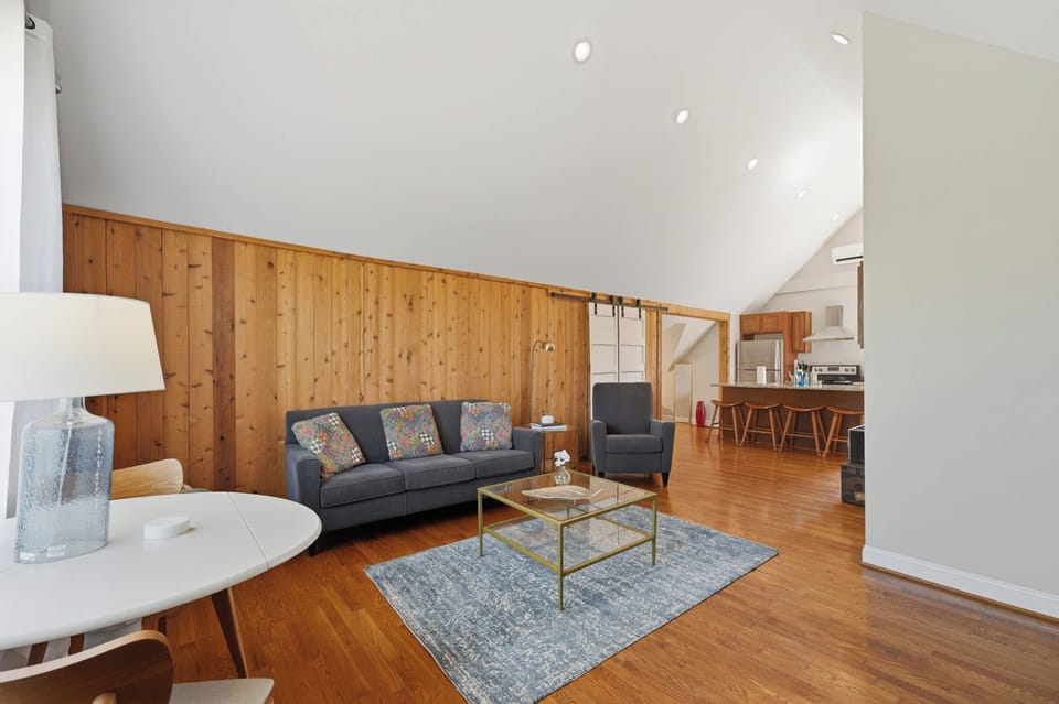 Living Room: Relax in a cozy living room with comfortable seating, warm natural light, and a welcoming layout perfect for unwinding, chatting, or enjoying a quiet night in.