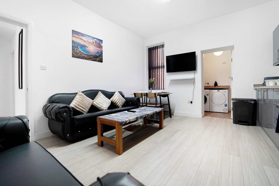 Experience modern simplicity in this cleanly designed bathroom, equipped with sleek fixtures and an efficient layout for your daily refresh. Well-lit and thoughtfully arranged, it offers a fresh, comfortable space for both morning and evening routine