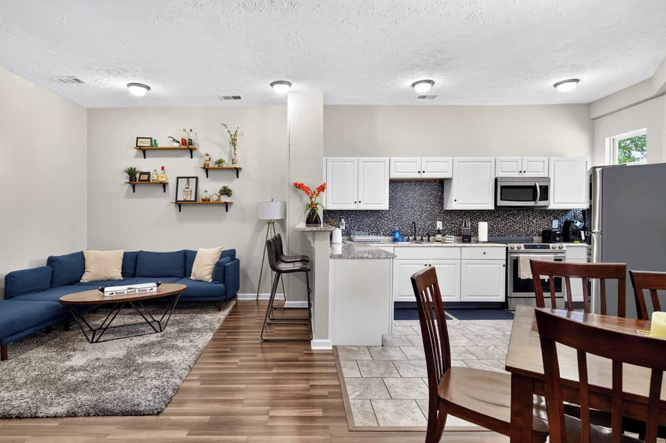 Living Room 1: A cozy and inviting living room with comfortable seating, warm décor, and plenty of space to relax, unwind, or enjoy quality time together after a full day.