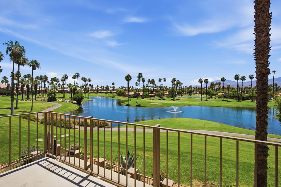 Private patio overlooking lush fairways and sparkling lake views.