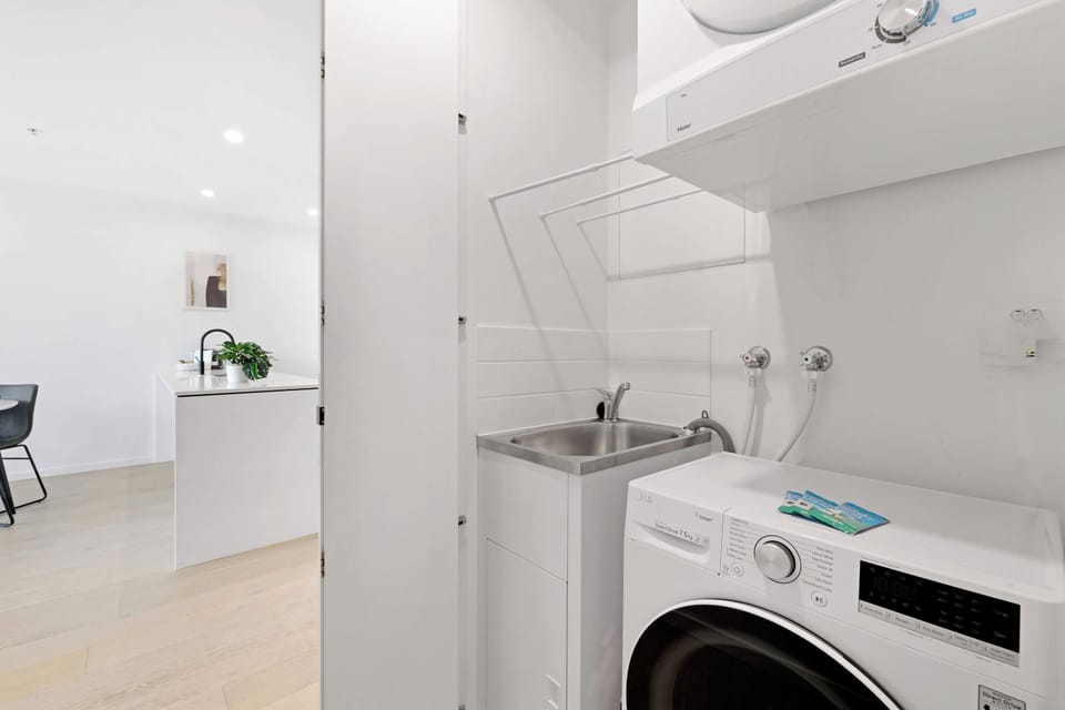 Take advantage of in-unit laundry facilities featuring a front-load washing machine and wall-mounted drying rack