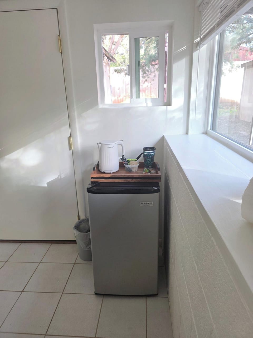 Minifridge with tea, coffee and hot water kettle.