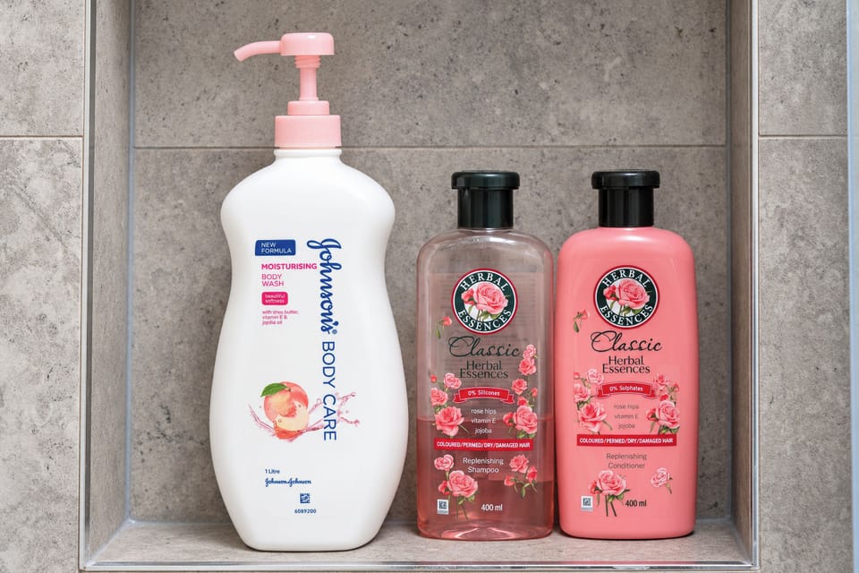 Stocked shower niche with full-size toiletries for a hotel-like stay