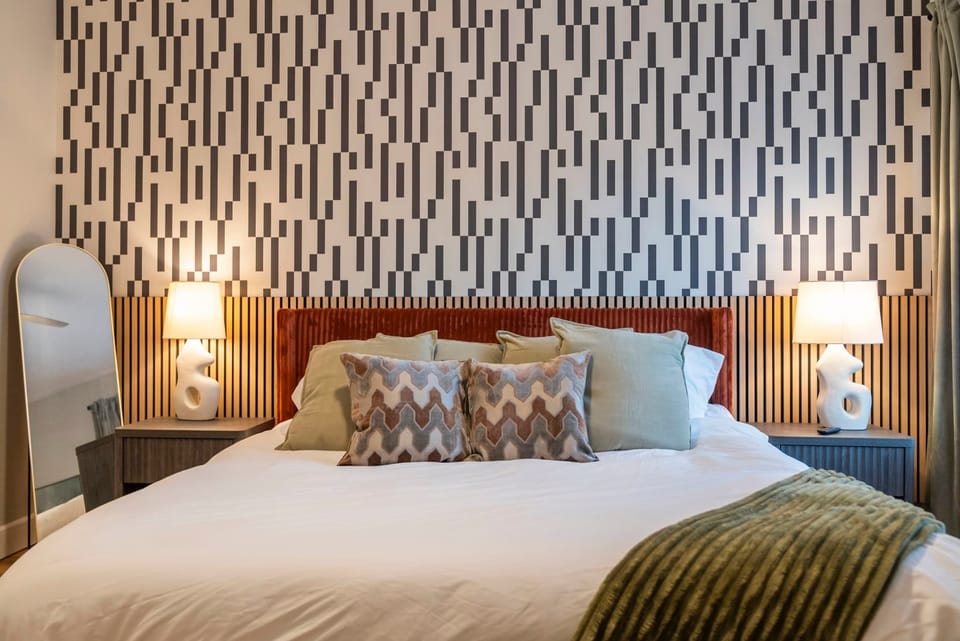 Warm bedroom with patterned accent wall