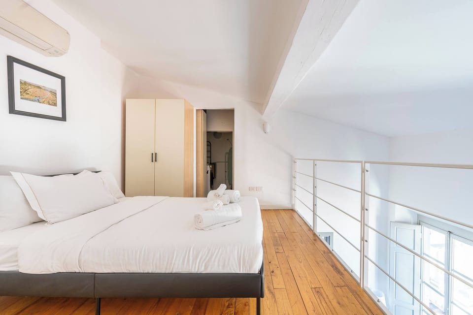Comfortable sleeping area overlooking the apartment's interior.