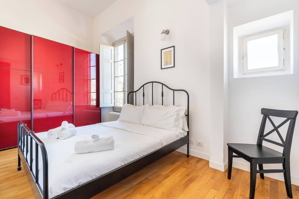Bright bedroom with a comfortable bed