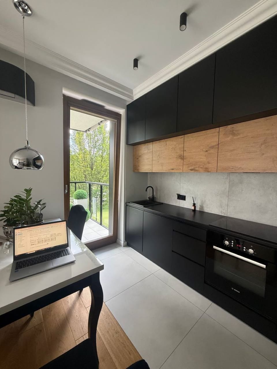 Comfort Apartment, Balcony, Courtyard View | Private kitchen | Electric kettle, cleaning supplies, paper towels, dining table