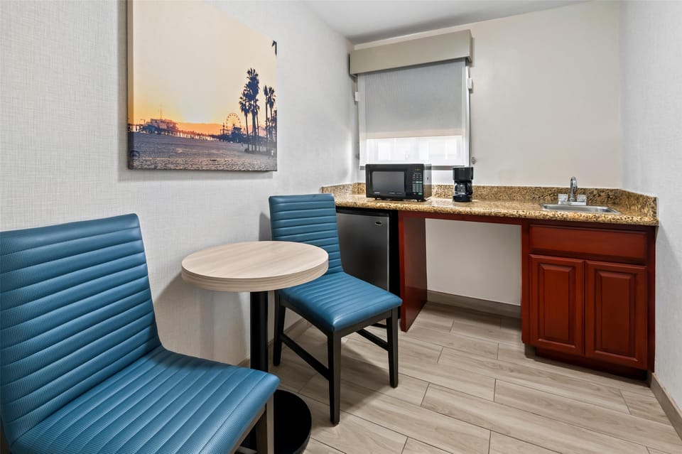 Standard Room, 1 King Bed, Refrigerator & Microwave, Courtyard Area | Pillowtop beds, desk, laptop workspace, blackout drapes