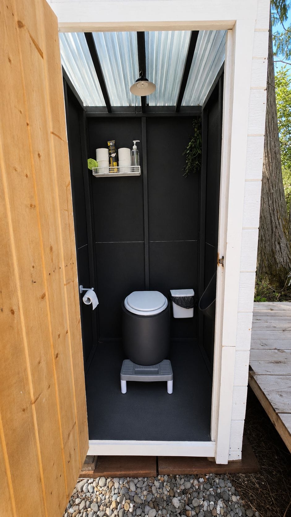 Eco-friendly composting toilet with built in exhaust fan. 