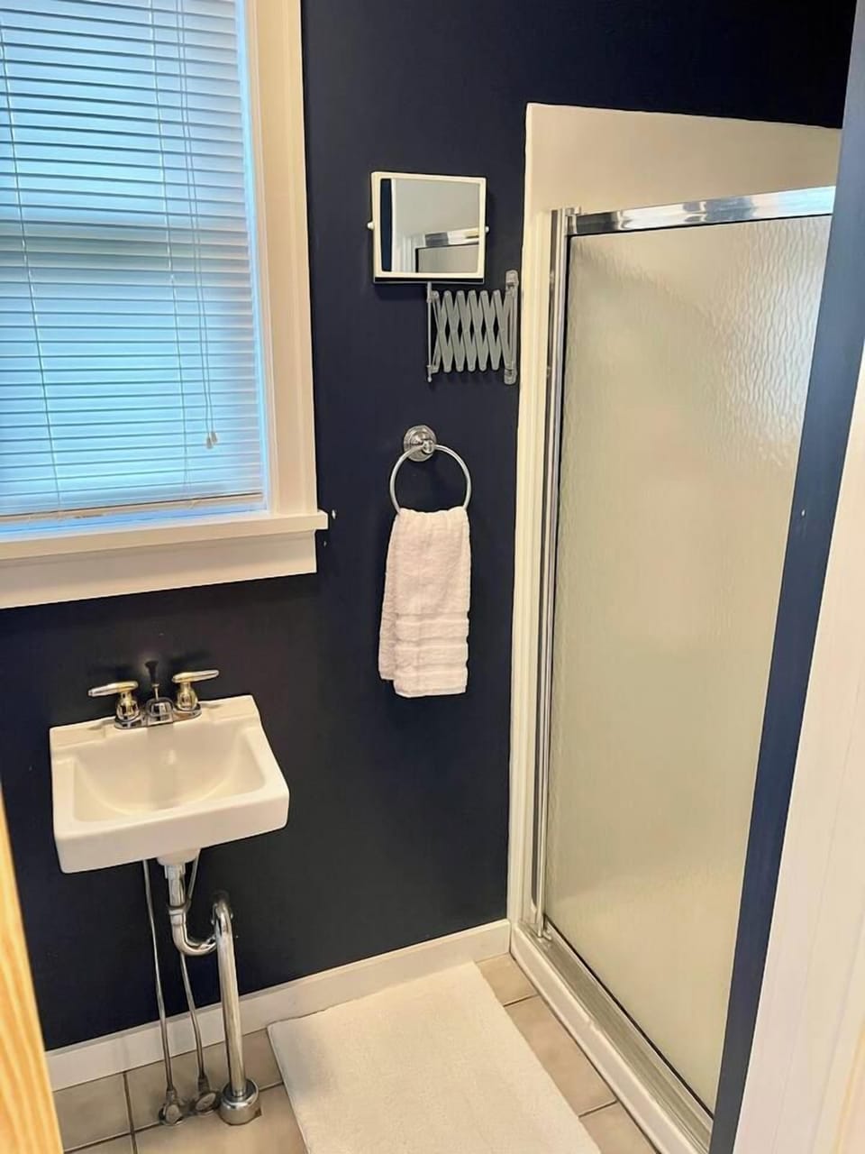 Main floor Bathroom with shower conveniently located off the kitchen