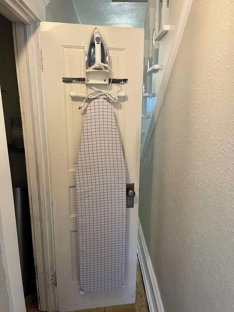 Iron and Ironing Board located in the main floor hallway closet