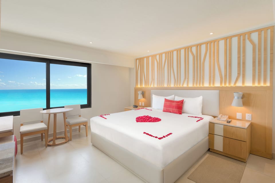 Romance Package, Ocean View | Free minibar, in-room safe, desk, blackout drapes