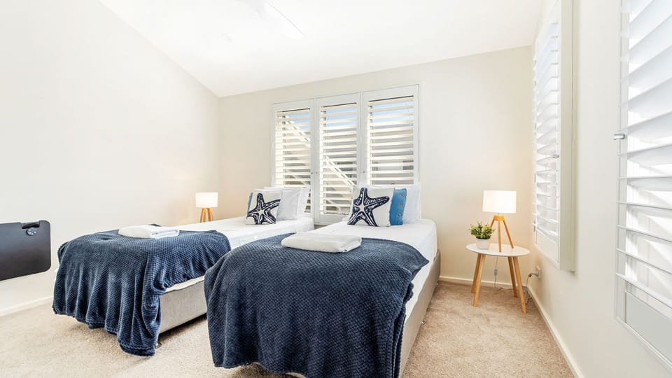 Sapphire Sands | Bedroom 3 | King single beds able to be made up as a super king | Ceiling fan | Heating