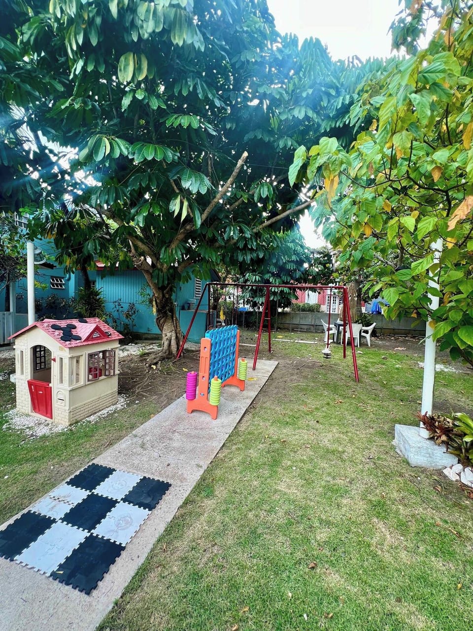 Shaded garden grounds with towering trees for a peaceful escape