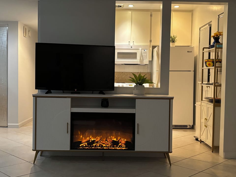 Electric fireplace with thermostat and timer, or choose no heat  for ambiance. 