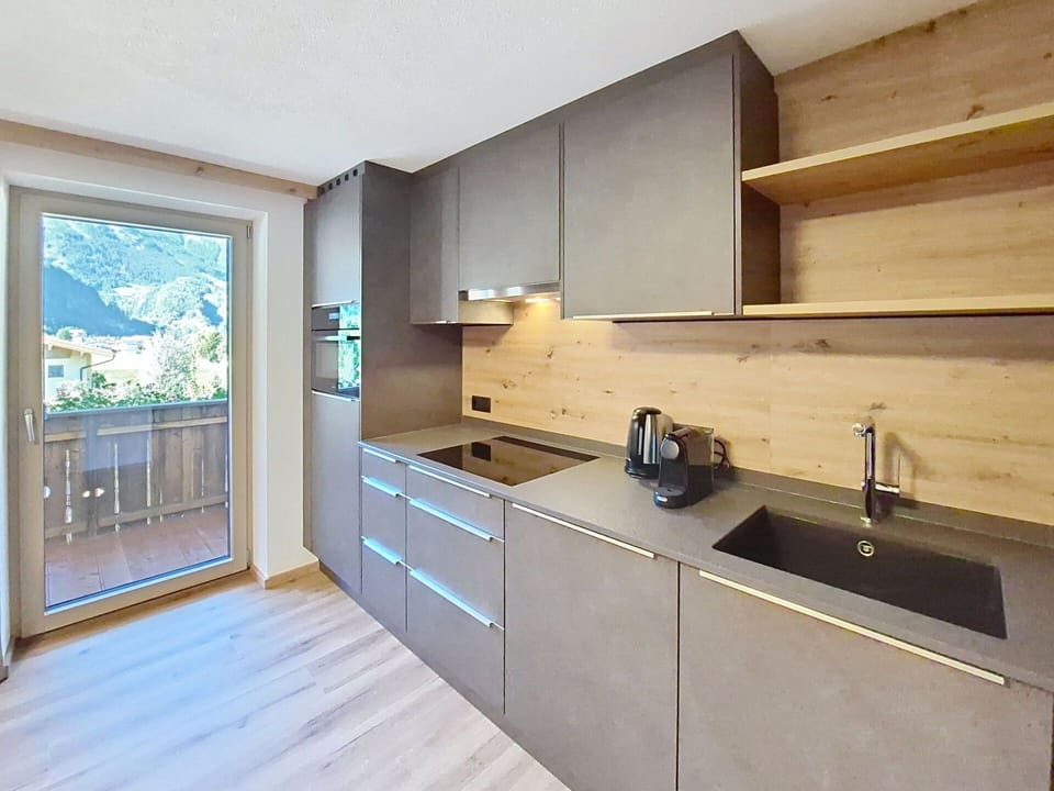 Kitchen, Flooring, Wood, Countertop, Interior Design, Cabinetry, Home, Floor, Home Appliance, Room