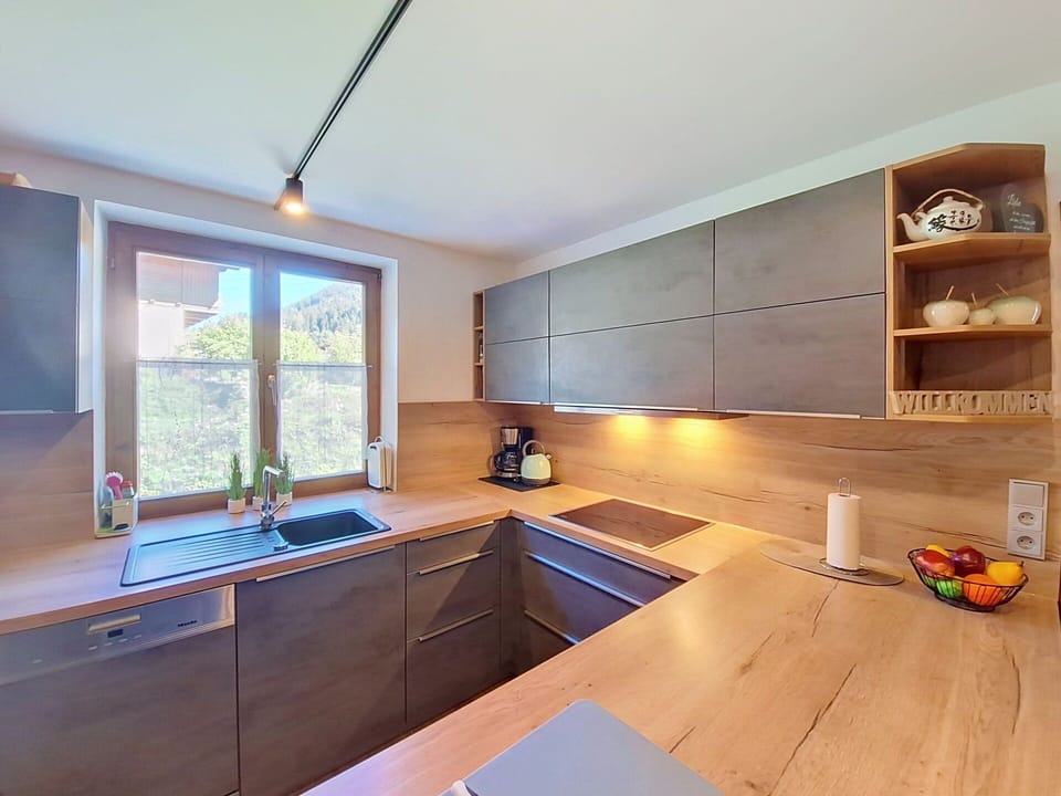 Flooring, Countertop, Wood, Interior Design, Kitchen, Furniture, Floor, Cabinetry, Kitchen Appliance, Home