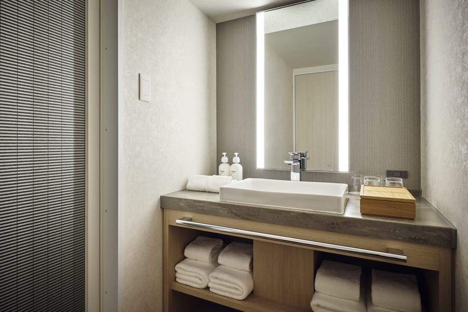 Suite, 1 Bedroom | Bathroom | Combined shower/tub, free toiletries, hair dryer, slippers