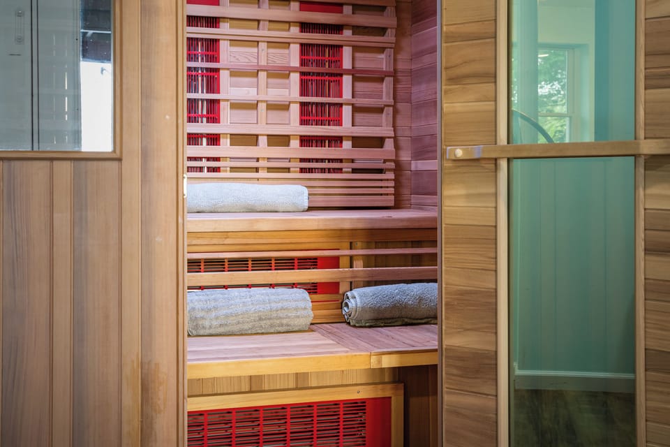 Infrared Sauna - Cedar benches and towels rolled and ready, a warm reset after a cold day on the lake.