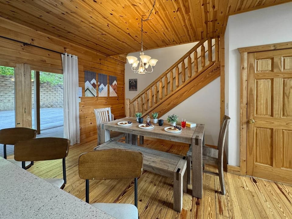 Dining Area: Gather around the rustic table, enjoying meals with nature just outside the window!