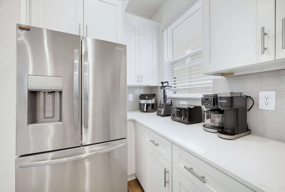 Full kitchen with stainless steel appliances