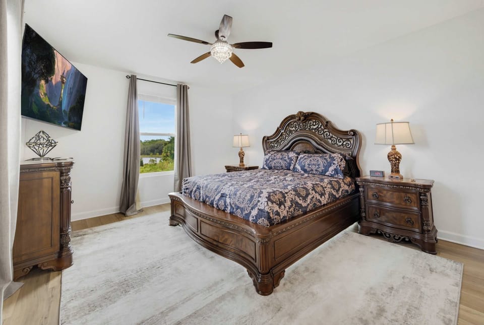 King bedroom with Smart TV, ceiling fan & spacious layout