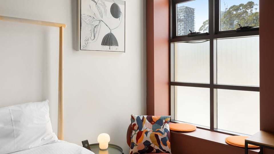 Cozy, modern bedroom with a view.