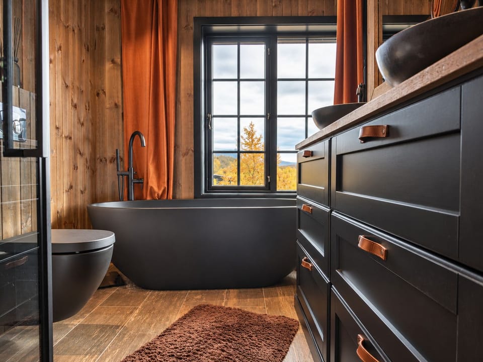Modern bathroom with spa bath looking right out over the mountains
