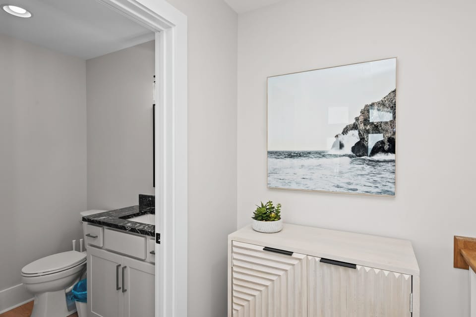 Step into a serene coastal retreat where crisp, airy vibes welcome you home.