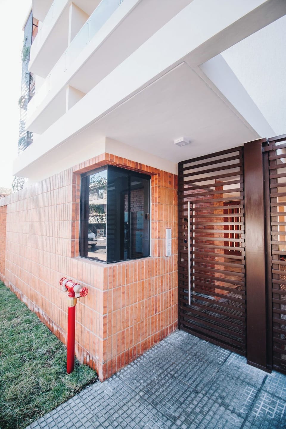 Access is guarded by electric gates and a security booth with a 12-hour day vigilance