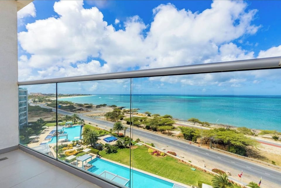The patio overlooks the ocean and both pools.  It's accessible from the main living area as well as the primary bedroom.
