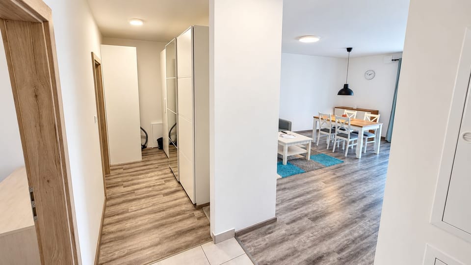 Bright modern entry with open dining area and ample storage