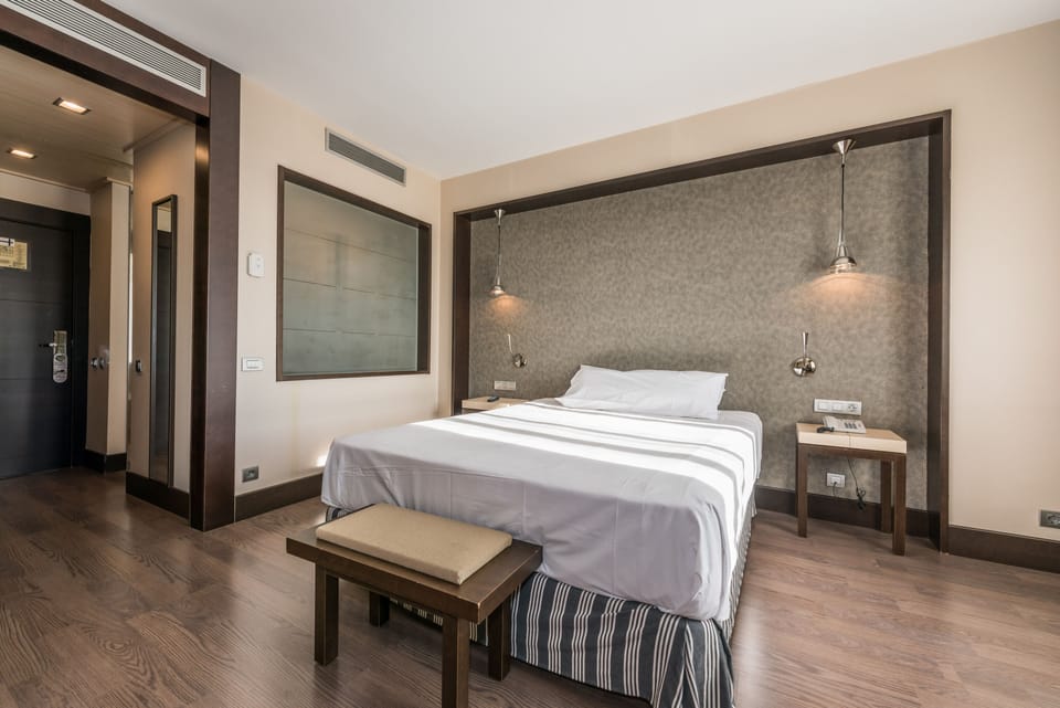 Standard Double Room | Free minibar items, in-room safe, desk, blackout drapes