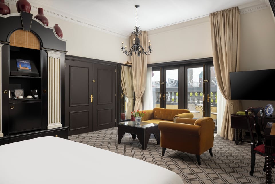 Junior Suite, 1 King Bed | Living area | 50-inch LED TV with satellite channels