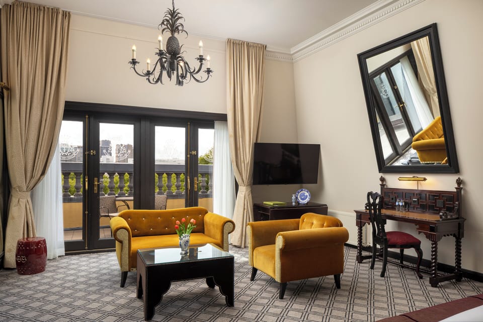Junior Suite, 1 King Bed | Living area | 50-inch LED TV with satellite channels