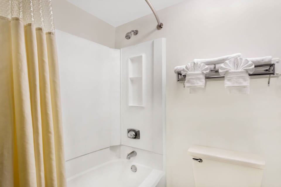 Desk, laptop workspace, blackout drapes, iron/ironing board