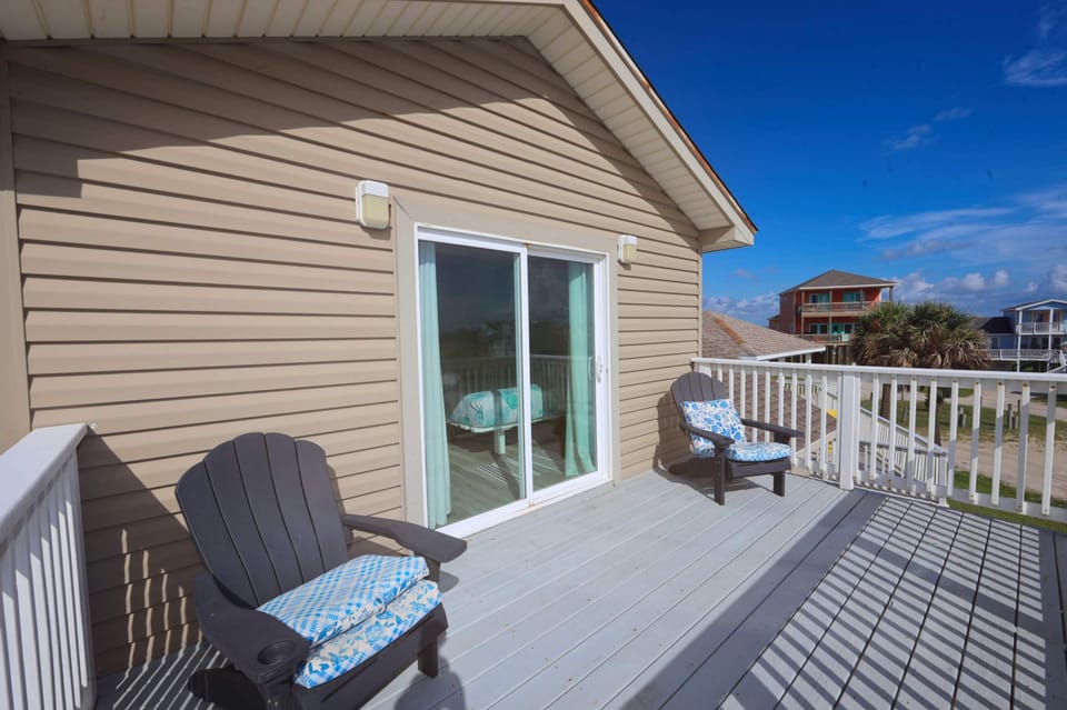 The second-floor king suite boasts a smart TV, private ensuite, & balcony​