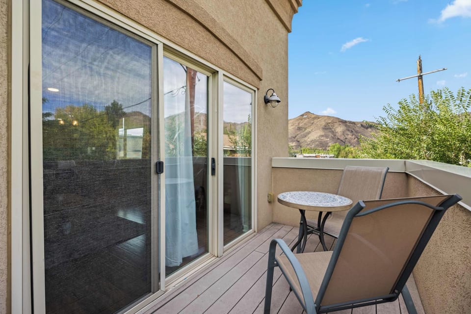 The private balcony from the living room provides views of the mountains in Golden.