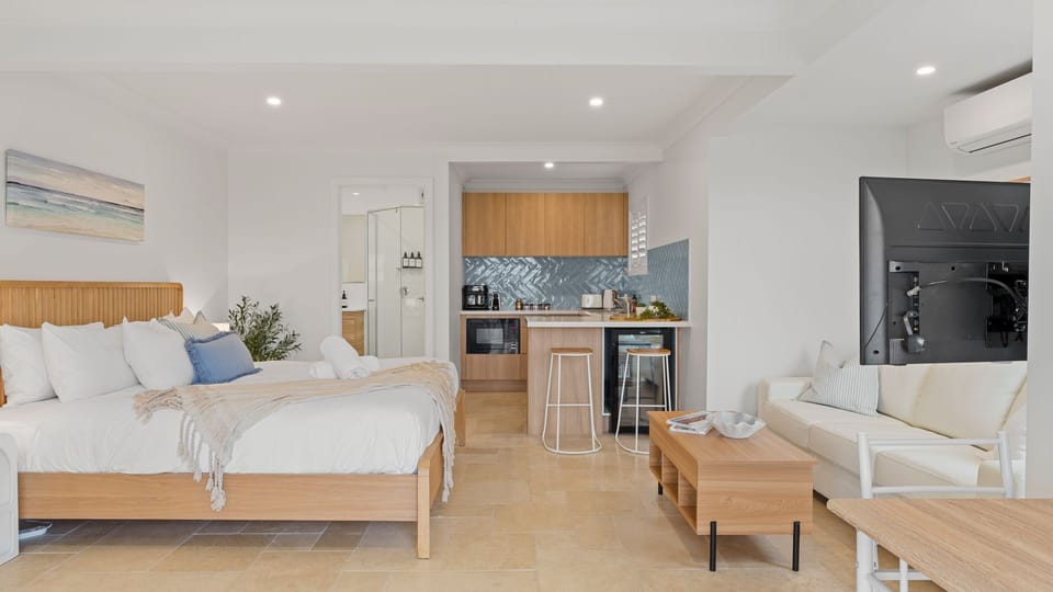Wide-angle interior perspective showing the bedroom layout connecting to the main living areas.