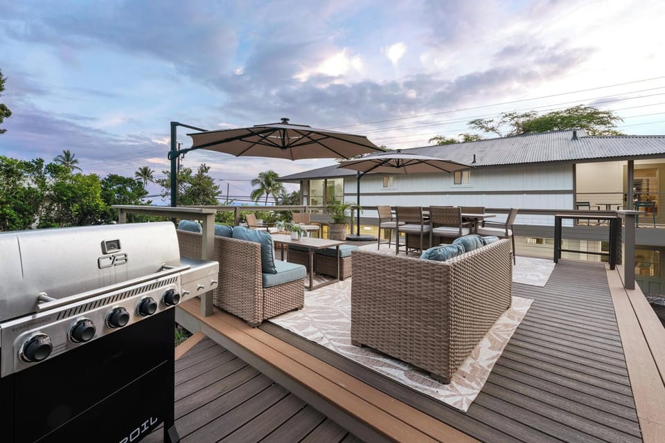 Your private rooftop oasis awaits with comfortable lounge seating, a BBQ grill, and covered dining area perfect for sunset gatherings and outdoor entertaining.
