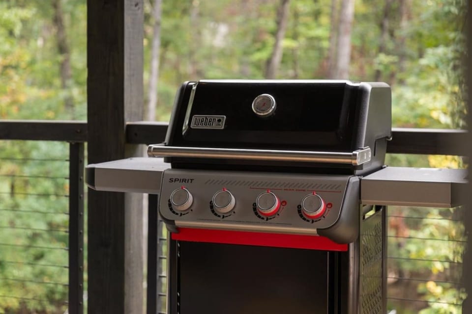 Propane grill on the covered deck; propane is included for guest use.