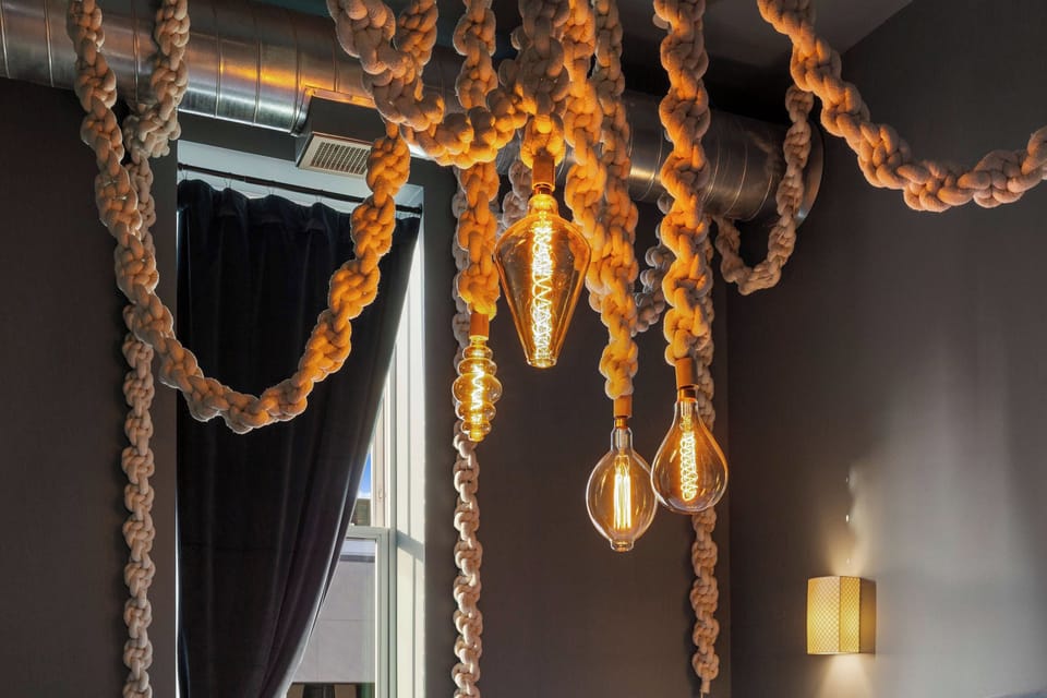 Master bedroom features an artistic light installation