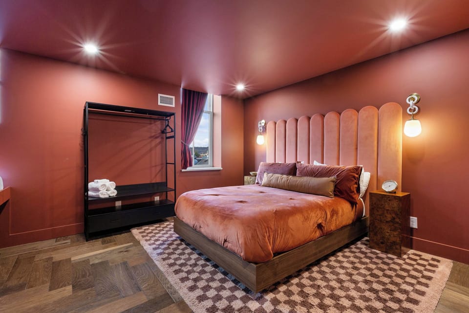 Master bedroom with a queen bed, twin bed and private en suite bathroom