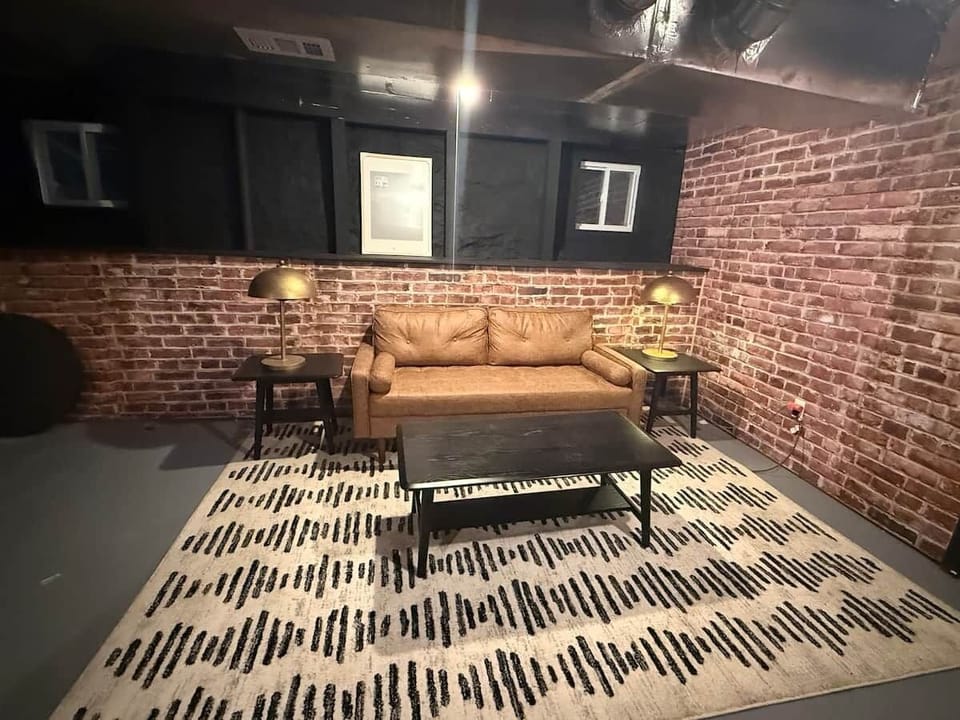 Lounge area - Basement couch and coffee table