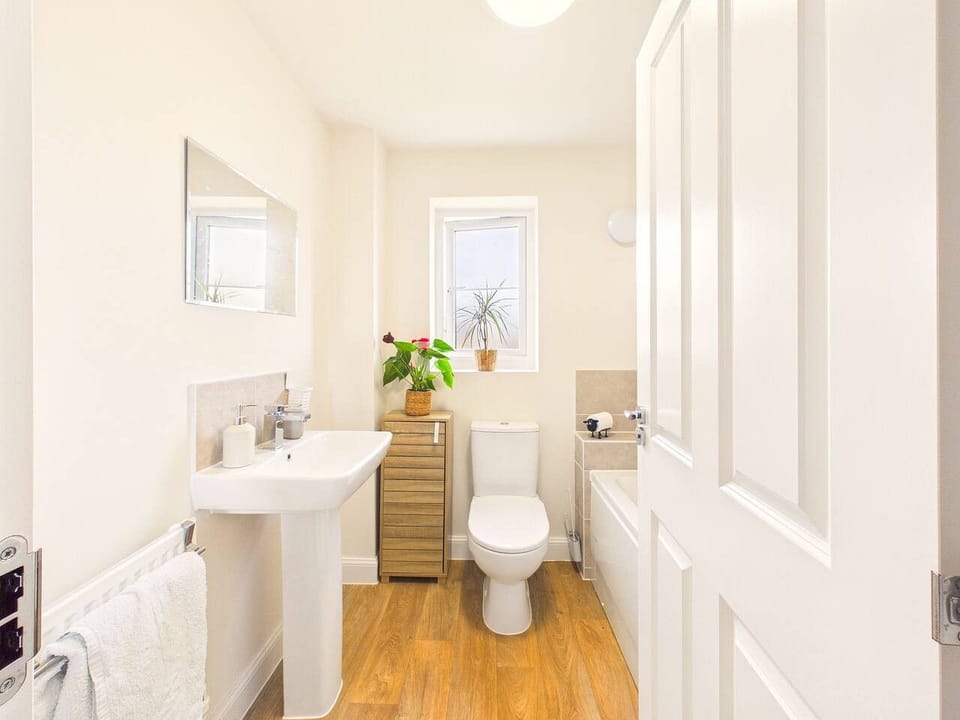 Handy downstairs cloakroom with WC and basin, a real bonus when the whole group is getting ready at once.